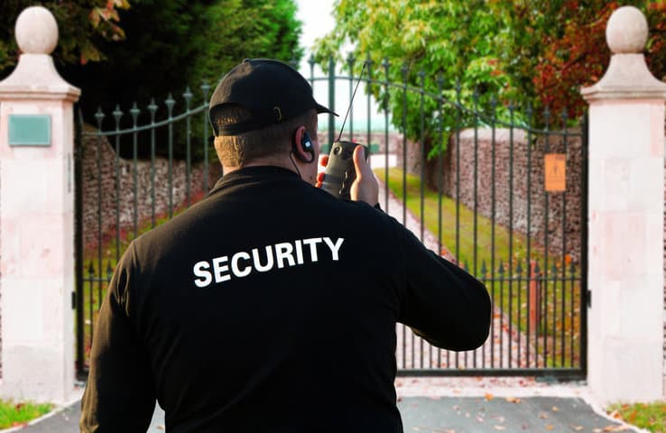 Security officer monitoring a controlled estate entrance in the Western Cape